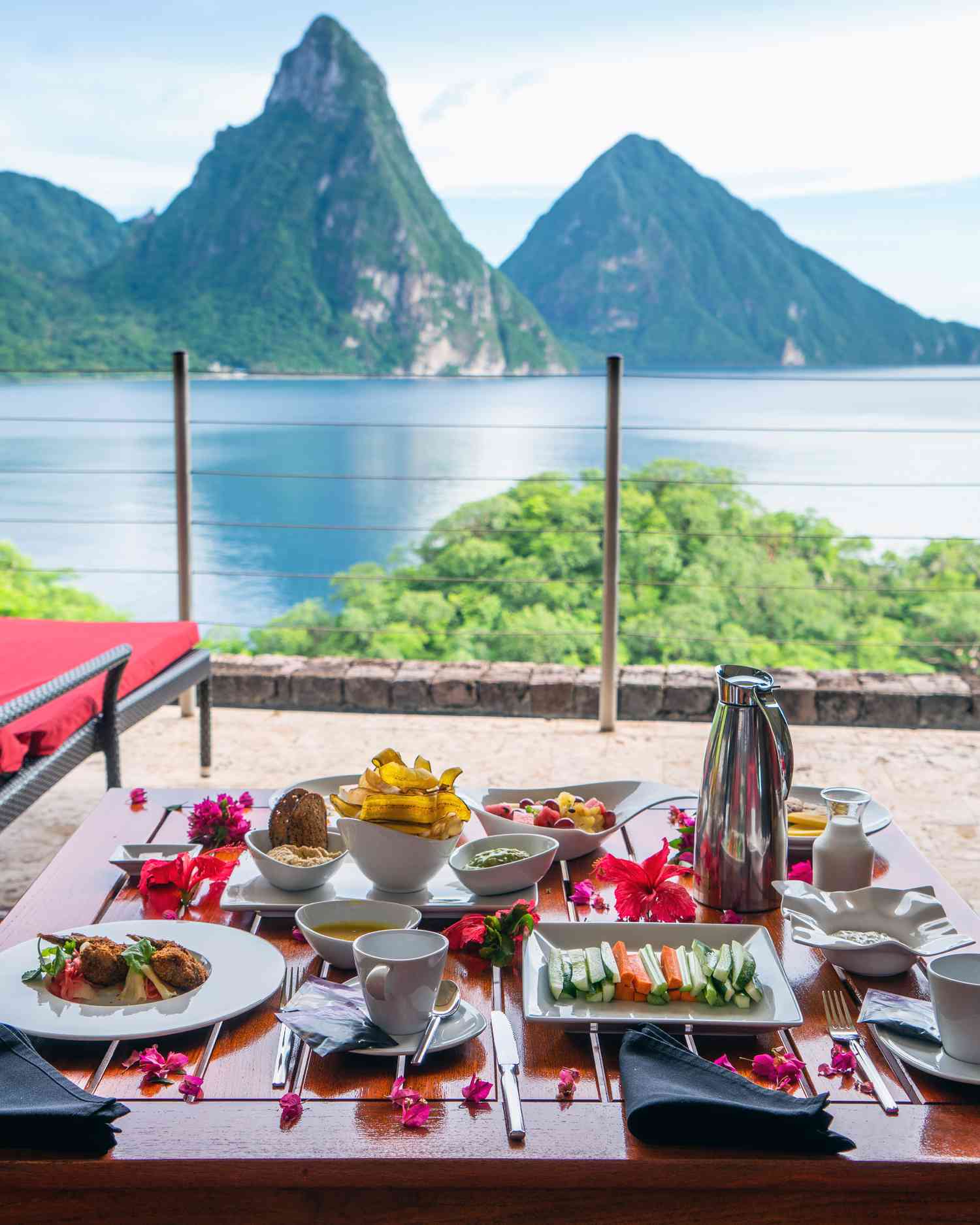 This is a picture of an all-inclusive resort, with fancy food and drinks by the ocean!